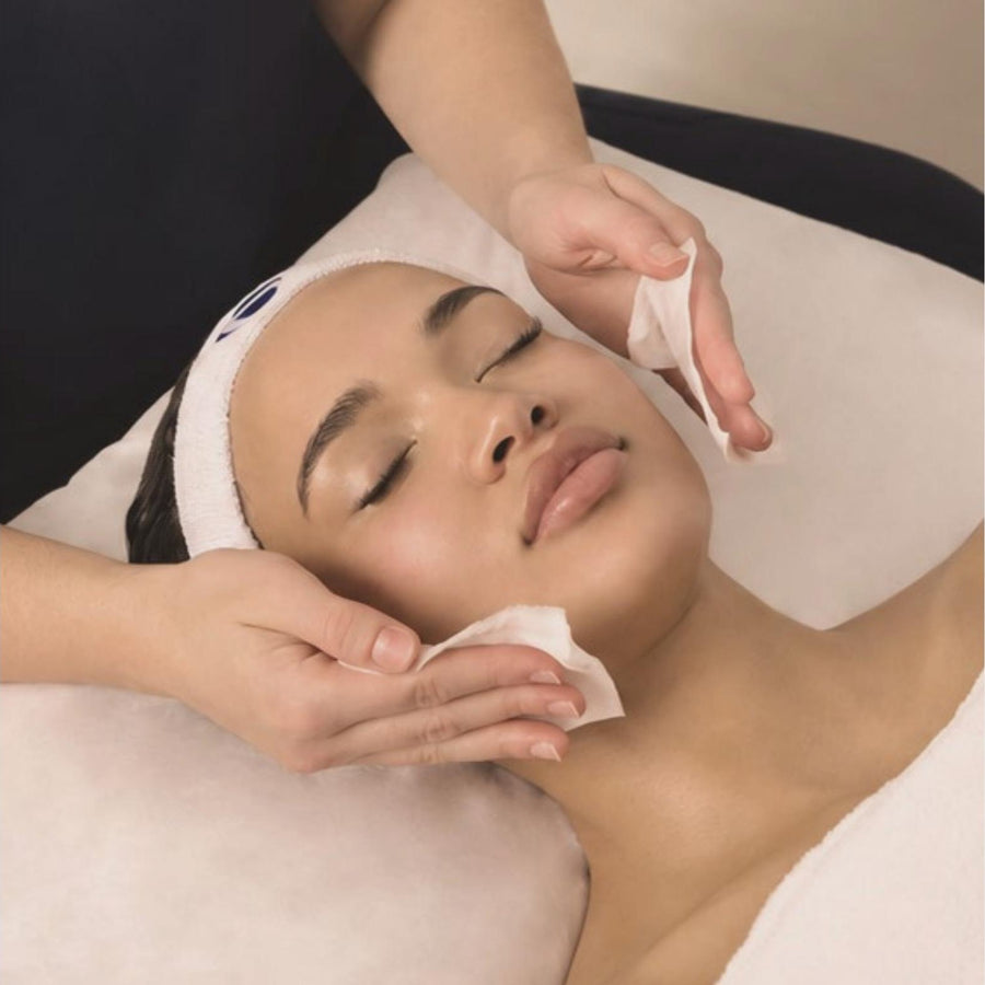 Client relaxing during a professional facial treatment