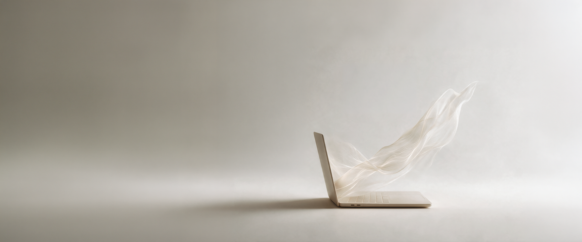 GCQ lead visual 1 – laptop with flowing ivory fabric