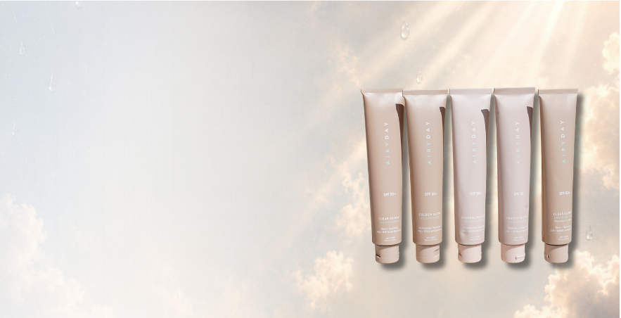 Airyday SPF50+ Dreamscreen tubes against a sky with light rays