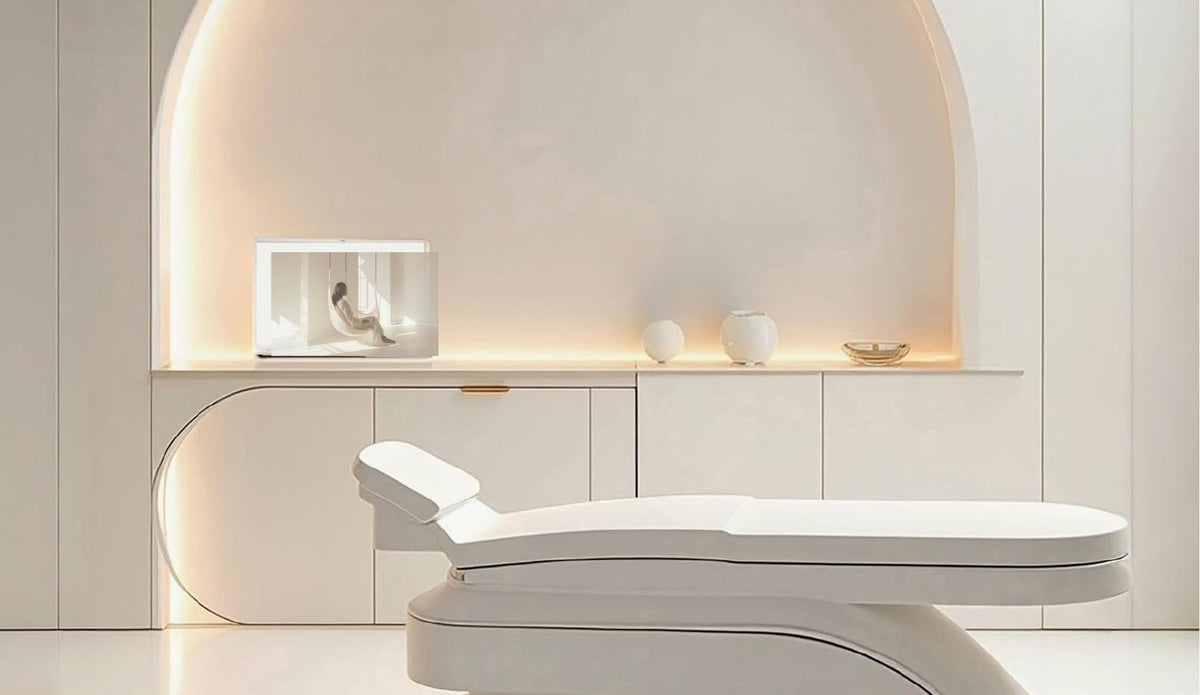 Calm clinic treatment room with a white treatment couch